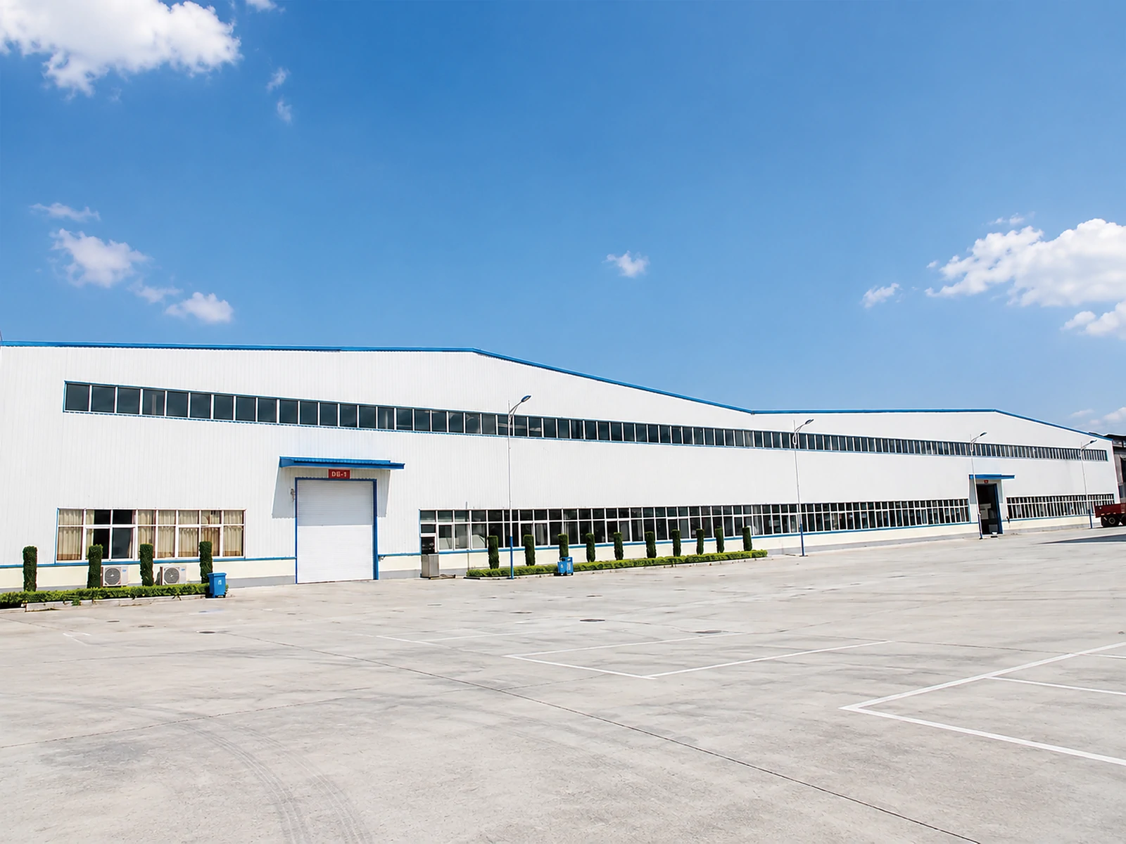 The PrintBar production building and loading yard, seen from across the site The PrintBar production building and loading yard, seen from across the site
