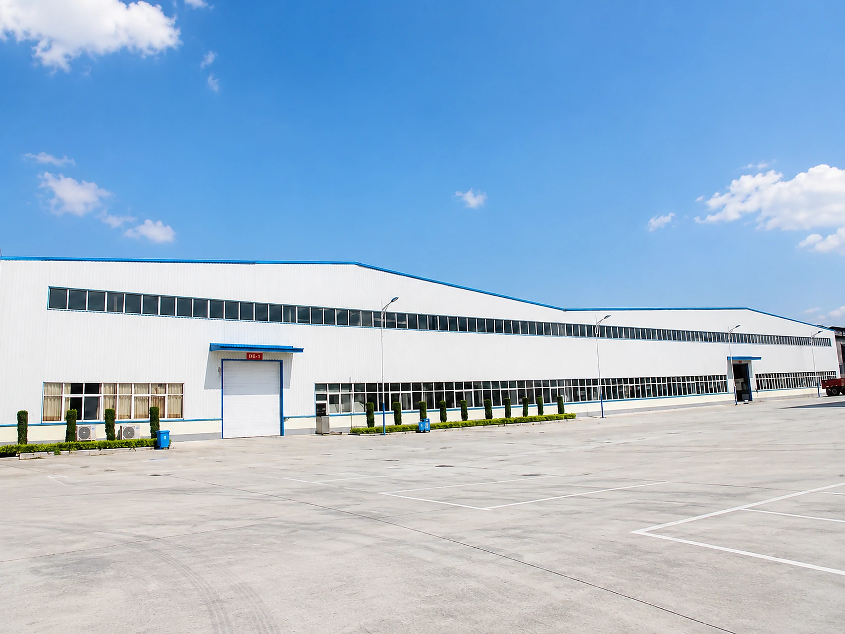 The PrintBar production building and loading yard, seen from across the site The PrintBar production building and loading yard, seen from across the site