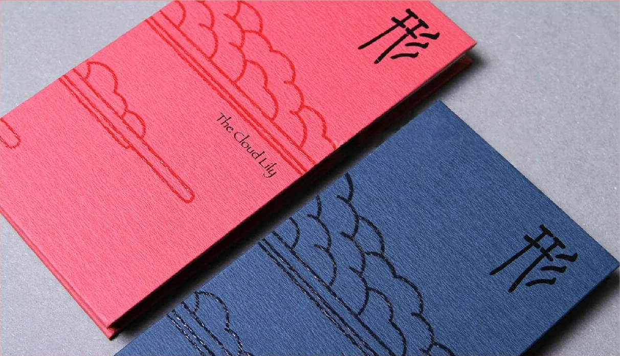 Spot UV and embossed linework on red and blue printed cards, showing raised contour and gloss contrast in packaging surface finishing